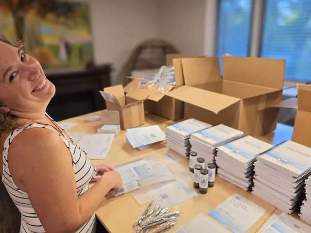 Havilah preparing welcome-bag materials for the RCMA 2026 Fall Meeting.